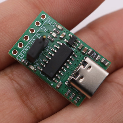 CH340C USB to TTL Module Displayed in Hand for Scale Reference